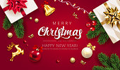 istock Merry Christmas Red Background with gifts box, green fir tree pine branch, red Christmas ball, golden deer, jingle bell and holly berry. Horizontal Christmas posters, greeting cards, website. Vector 1285643349