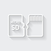 istock Micro SD card - Front and back view. Icon with long shadow on blank background - Flat Design 1370681137