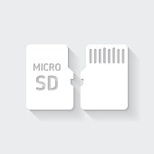 istock Micro SD card - Front and back view. Icon with long shadow on blank background - Flat Design 1382128758