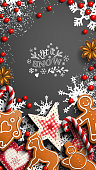 Mobile phone Christmas wallpaper, gingerbread cookies, ornaments, candy canes and anise stars laying on black background, with text Let it snow, vector illustration, eps 10 with transparency