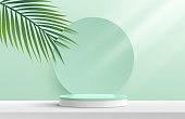 istock Modern white, green cylinder pedestal podium. Green pastel circle backdrop with green coconut leaf. Abstract vector rendering 3d shape product display presentation. Minimal wall scene. Summer concept. 1318095670