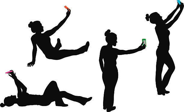 MoreSelfies A young woman takes selfies with her smart phone. selfie silhouettes stock illustrations