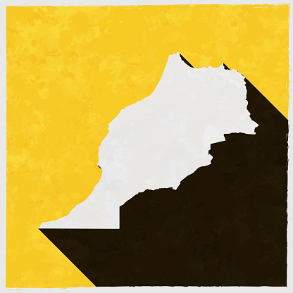 Morocco map with long shadow on textured yellow background