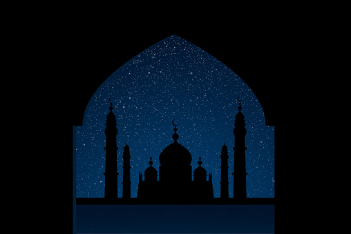 Mosque on starry night sky with blue glow.