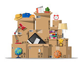 Moving to new house. Family relocated to new home. Paper cardboard boxes with various household thing. Package for transportation. Computer, lamp, clothes, books. Vector illustration in flat style