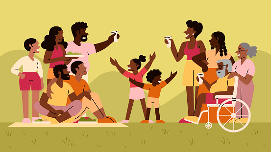 A Multigenerational Black Family and Friends Enjoy a Picnic Celebration in the Park