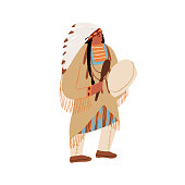 istock Native American shaman, tribal magician beats the drum and dancing. Wild West Indian American man in traditional ethnic costume performing ritual dance of indigenous people of America. 1372372461