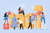 New Year 2022 holiday celebration concept.  Modern vector illustration of people decorating for Christmas party