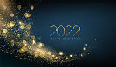 2022 New year with Abstract shiny color gold wave design element and glitter effect on dark background. For Calendar, poster design