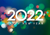 Join the countdown party on the New Year's Eve of 2022 with clock and 2022 on the colorful sparkling lights background
