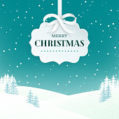istock Night winter scene landscape background with snowy field and fir trees. Paper 3d label with silver bow and ribbon on the teal background with falling snow. Merry Christmas nature background. Vector. 1059165392