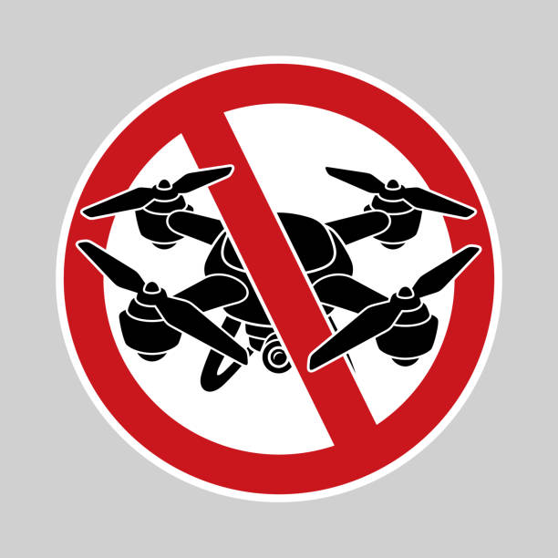 No Drones Zone sign No Drones Zone sign. Prohibition sign isolated on gray background. drone silhouettes stock illustrations