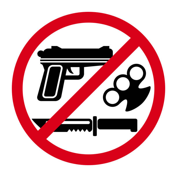 no weapons sign with red round and symbols of knife, gun and brass knuckles - savaş aleti stock illustrations