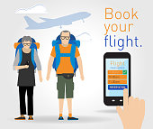 Senior adult backpackers using a phone app to reserve a commercial flight