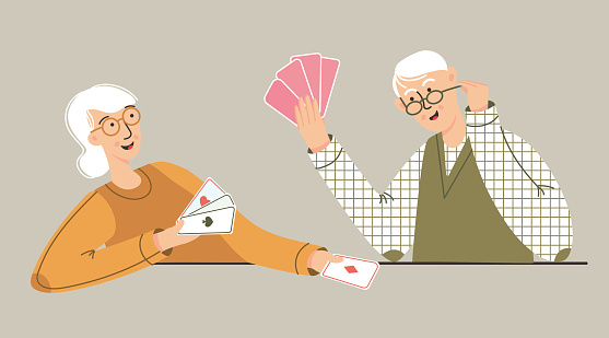 Older man and woman playing in card games. Seniors family or elderly friends spend time together