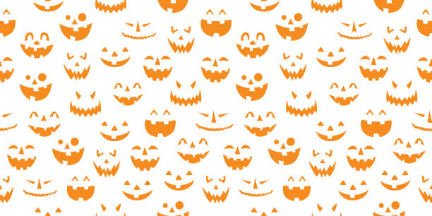 Orange Pumpkin Faces On White Background Vector seamless pattern of orange pumpkin faces on a white background. carving craft product stock illustrations