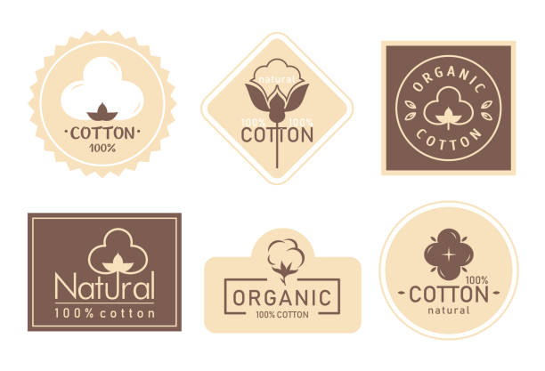 Organic cotton label vector illustration set, mark logo icons collection with cottonseed branch plant symbol emblem, natural bio organic product Organic cotton label vector illustration set. Mark logo icons collection with cottonseed branch plant symbol emblem, natural bio organic product, fabric quality fiber for knitting and textile industry cotton stock illustrations
