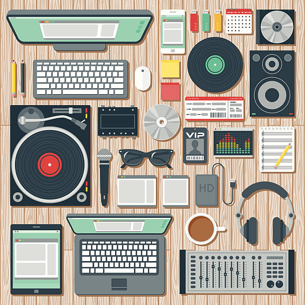 Overhead View of a Disk Jockey's Desk Space An overhead view of items you might find on the desk of a DJ (disk jockey), including: Laptop, tablet, smart phone, computer, turntable, headphones, splitter, speaker, CDs, records, microphone, hard drive, equalizer software, VIP pass, concert ticket, USB Flash drives, mixer, and so on. No gradients or transparencies used. File is organized into layers and each icon is properly grouped for easy editing. sound recording equipment illustrations stock illustrations