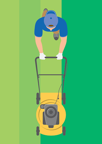 Overhead view of man mowing lawn