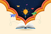 Paper cut of open book with learning,education and explore concept landing page background.