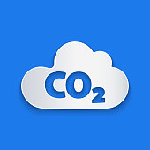 Paper cut CO2 emissions in cloud icon isolated on blue background. Carbon dioxide formula, smog pollution concept, environment concept. Paper art style. Vector Illustration