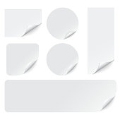 Paper stickers with curled corners on white background. Realistic paper adhesive sticker set. Sticky label banner mockup. Vector