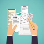 istock Paying bills. Hands holding bills and pencil. Payment of utility 538194132