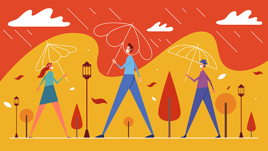 People in rain stand under umbrellas in city park
