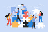 istock People searching for creative solutions. Teamwork business concept. Modern vector illustration of people connecting puzzle elements 1306949457