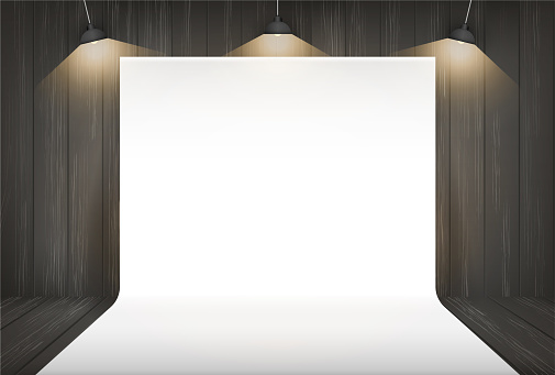 Photography studio background with lighting in dark room space.