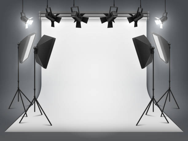 Photography studio. Photo backdrop and spotlight, realistic floodlight with tripod and studio equipment. Vector studio background Photography studio. Photo backdrop and spotlight, realistic floodlight with tripod and studio equipment. Vector professionals studio background studio shot photos stock illustrations