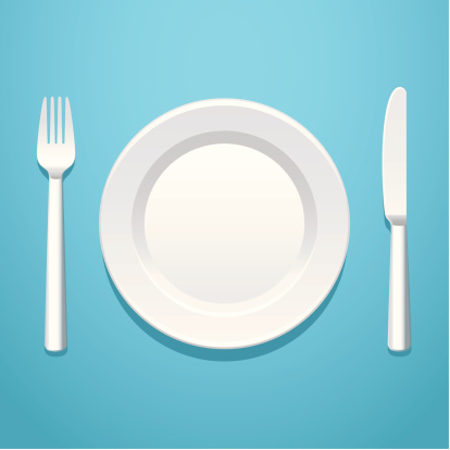 A place setting with a knife, fork, and plate