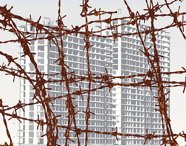 Prison Editable vector illustration of building behind barbed wire with building and wire as separate objects rusty fence stock illustrations