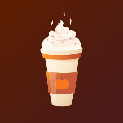 Pumpkin latte with cream in a cup.