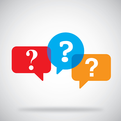 Vector illustration of a three multi-colored speech bubbles with question marks against a grey background.