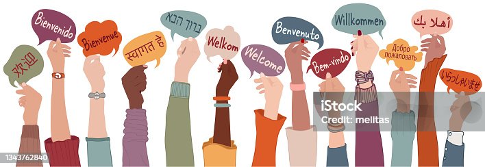 istock Raised arms and hands of multi-ethnic people from different nations and continents holding speech bubbles with text -Welcome- in various international languages.Communication. Community 1343762840