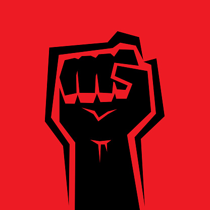Vector illustration of a black raised fist against a red background.