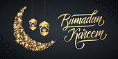Ramadan holiday banner with handwritten inscription Ramadan Kareem, gold sparks crescent moon and golden colored arabic lanterns. Vector illustration.