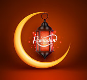Ramadan kareem vector greetings design with lantern or fanoos hanging in yellow crescent moon in red background. Vector illustration.