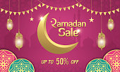 Ramadan Sale, web header or banner design with golden crescent moon, arabic lanterns and islamic ornament on purple background. Up to 50% discount offer