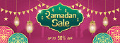 Ramadan Sale, web header or banner design with golden shiny frame, arabic lanterns and Islamic Ornament on purple background. Up to 50% discount offer