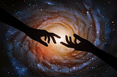 Romantic vector illustration with hand silhouette and astronomical object in cosmos. Dark starry background. Elements of this image furnished by NASA