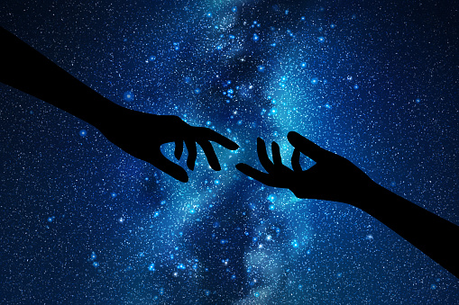 Hand gesture silhouette. Night starry sky, Milky Way