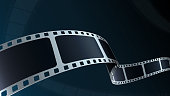 istock Realistic 3d Film strip cinema on blue background with place for text. Modern 3d isometric film strip in perspective. Vector cinema festival. Movie template for festival poster, backdrop, brochure. 1302499179