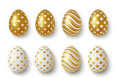 Realistic Gold and white easter eggs with geometric ornaments. Vector illustration.