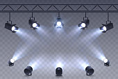 Realistic Spotlights isolated on transparent background. Scene illumination. Suspended and standing lighting. Elements for photo studio, show, scene. Vector illustration.
