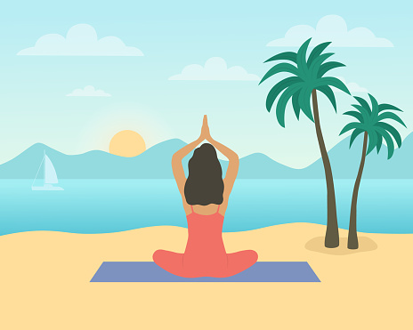 Rear View Of Woman Sitting On The Beach And Performing Yoga In Front Of Sunrise