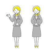 A receptionist(gray suits woman)　One is raising her right hand, one is looking down.