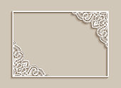 Rectangle frame with lace corner pattern, cutout paper ornament, template for laser cutting or wood carving, elegant decoration for wedding invitation or name place card design
