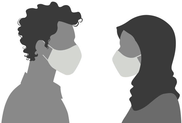 Side view of male and female silhouette wearing mask
